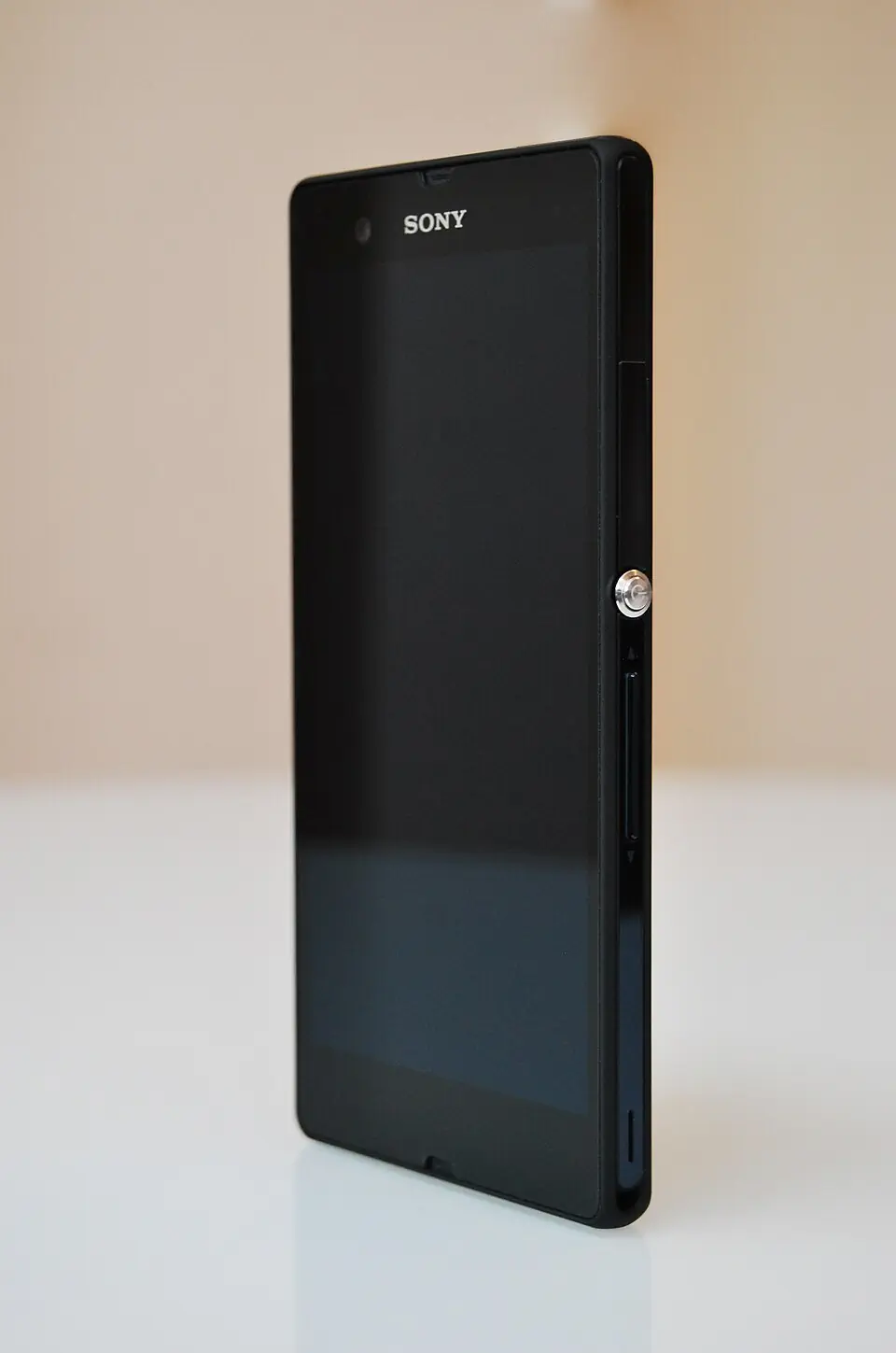 Black Xperia Z C6603 side showing round power key and side openings