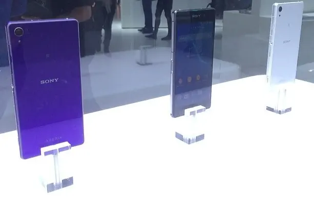 Purple, black and white Xperia Z2 exhibition handsets, original full stand photograph from 2014