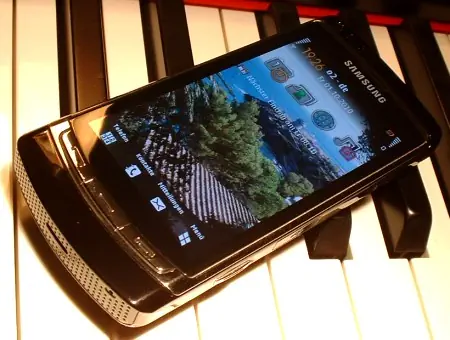 Samsung i8910 HD 实物；屏幕为用户自定义主页，不代表默认系统界面